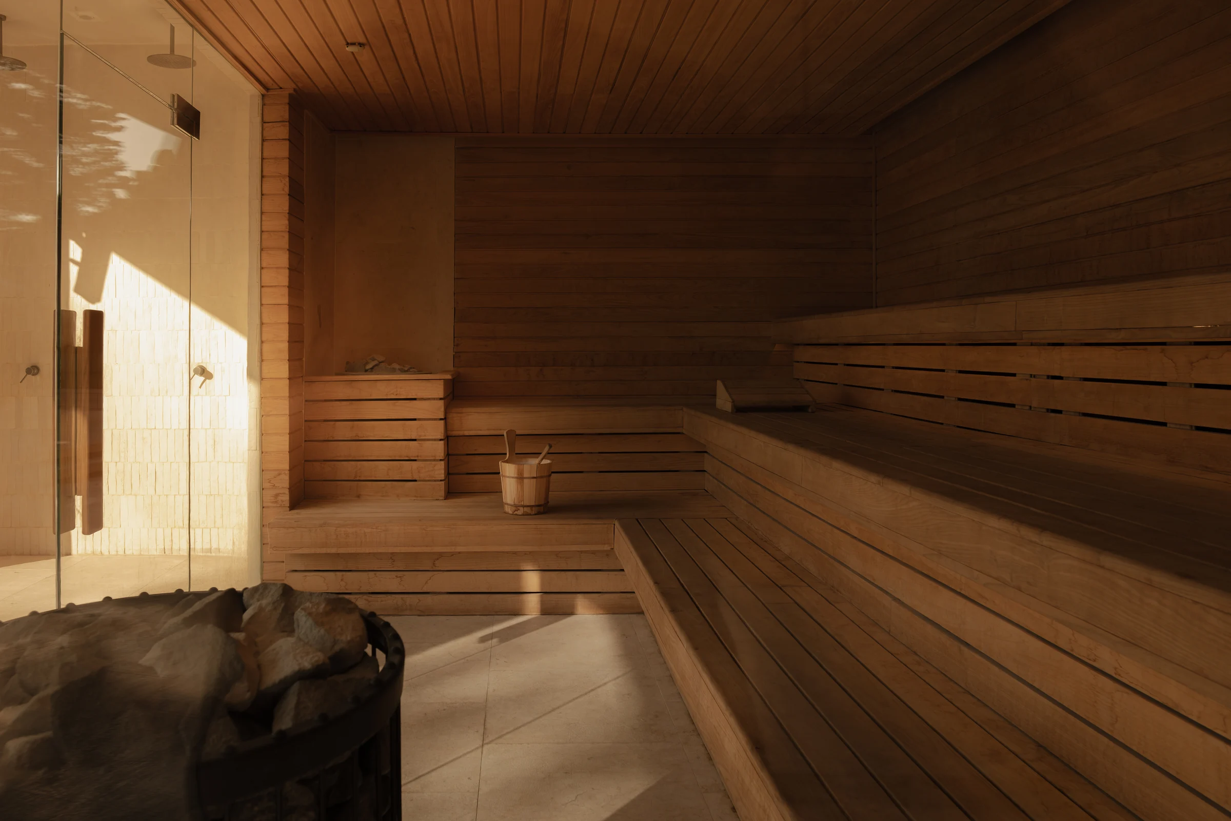 Sunlit timber benches in the sauna.